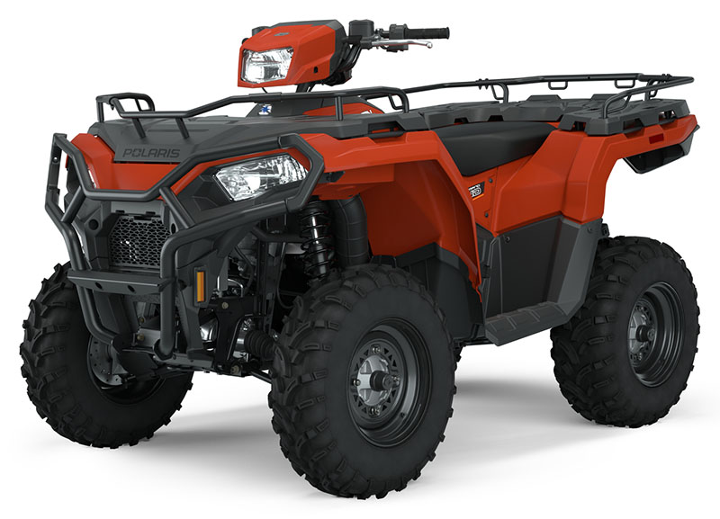 A red Polaris all-terrain vehicle (ATV) with large rugged tires, black front and rear racks, and protective front grill, shown on a white background.